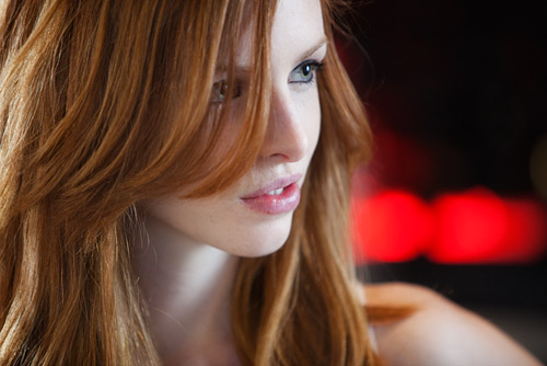 Simple bar lights out of focus make a great background. Shooting into the shadowed side of Eleanor
