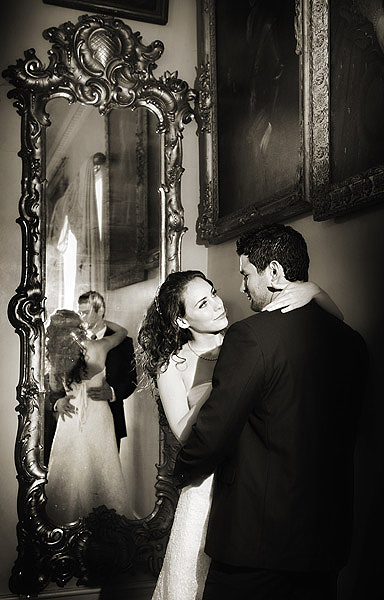 C0002 2. Whilst you have the couple together, get them to show a moment of tenderness. I like to surprise clients at viewings with images that they didn't "see" I placed the Arri to the right of the couple and shone it into the mirror, with the couples heads aligned off centre it allowed me to illuminate both their faces with the lamp and its reflection