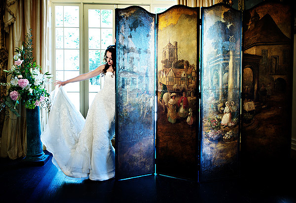 C0004 4. This shot and the one below are my classic reveal shots for dresses that have longer trains. I couldn't resist using the old changing screen in front of the large French windows. A simple adjustment of colour temperature in camera gives me two looks instantly. I love the richer amber hues of shot 5, giving the feeling of late low summer sun filling the old ballroom. Both images were lit with an Arri 300w.