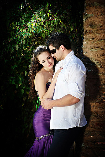 C0020 20. Final session of the day was shot outside as the weather was so beautiful. Technically not Cherish as it was outside, but when you have a late summers afternoon and the dresses are couture rather than bridal we can bend the rules. Well I can, cos its my brand :) I came across this old doorway in the garden wall. surrounded by rambling roses. Placing Sarah and Fran in the cool shade and using the sun as a backlight through the foilage, I demonstrated the lastolite panelite. From some distance we were able to illuminate our gorgeous couple.