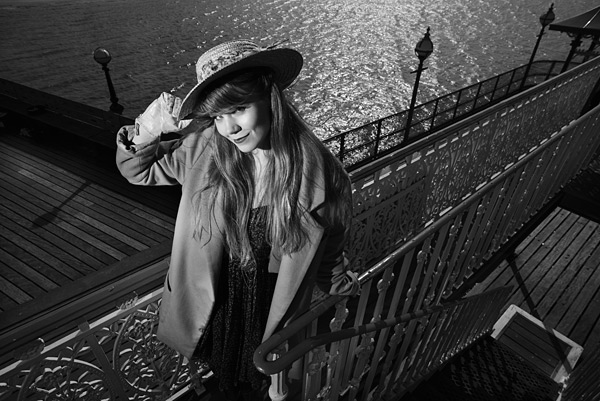 test_10 10. The pier has many cast iron railings and features. I used one Speedlight to light Sarah.