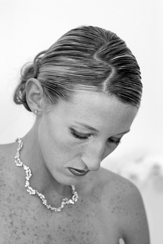 01_03 The bride was obviously proud of her hair style so Julie made a feature of it with this shot. A blip of flash high above the camera acts as a ‘hair light’ while the pensive expression reflects the gravity of the occasion. ISO 400 f/4 at 1/60th