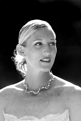 01_14 A stunning image: the bride was lit beautifully by the late sun shining through some distant trees. We always use Photoshop when an image demands it – in this case the dark bushes behind the bride were rendered to black. ISO 800 f/4 at 1/700th