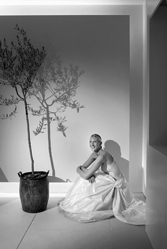 01_17 It pays to prepare. After setting up my small 300w tungsten spotlight (with barn doors for greater control) on a stand, and planning a trio of shots with Julie, we called in the bride and groom. Panning the light between pictures allowed its stand to stay in the same place whilst we shot the pre-rehearsed images in quick succession. ISO 400 f/4 at 1/30th