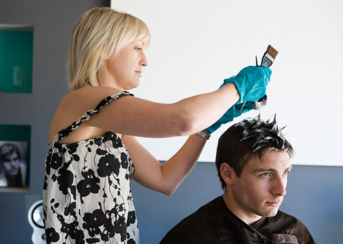 Anna from the Stuart Holmes salon sorts out the hair colour of one of the models in the studio