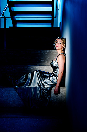 Chris found Charlotte lurking under the other staircase in a pool of light. Or was it set up? 