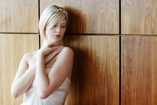 A soft pose and simple lighting makes a picture that could be taken in any hotel.