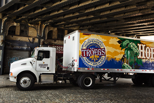 I had to get this shot of a passing truck. I didn't have the right lens on to get it all in but it shows you one of the bridges we were shooting under at times.