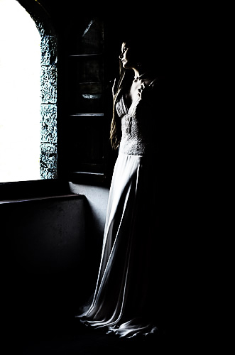 A very low key shot exposed for the highlight dress detail at the sacrafice of the shadow detail.