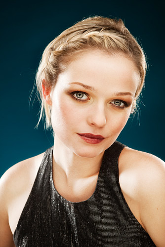 Cutting flash power to the background light results in a deep low luminance shade. I used 2 kick lights, a soft key and a pair of Lastolite reflectors to light this shot of Chloe.