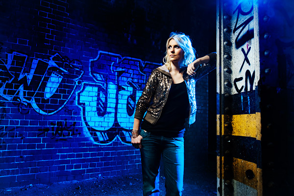 We used a SB-900 in a Lastolite Ezybox with a Honl full orange CTO gel and a and a 