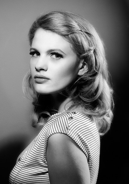 100mm lens at f/11 I used a simple two light set up for this shot. The keylight was slightly broader (nearer the camera) than is usual for my style but I kept the shadow under the cheekbone to give definition. This is a very classical over the shoulder look and the light has produced wonderful catch lights in Chloe’s eyes. I added a second light from the right to provide some rim separation. This is most clearly visible on her arm and her hair.