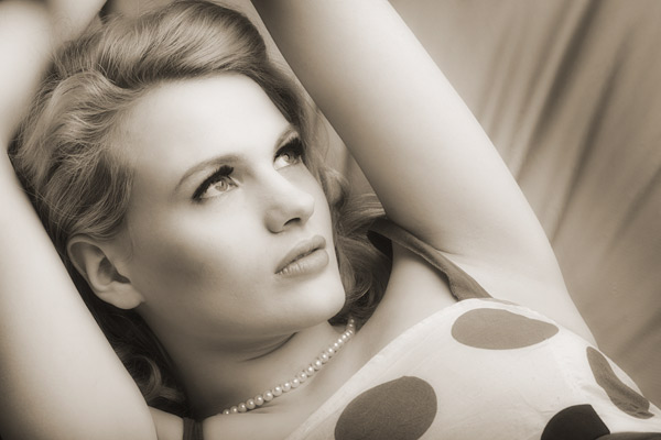 100mm lens at f/11 The same soft box from above only this time Chloe is on a bean bag. Notice the shadow under Chloe’s cheek bone. It is vitally important to set soft boxes well so the you concentrate on creating the definition that is so easy to loose with flat lighting.