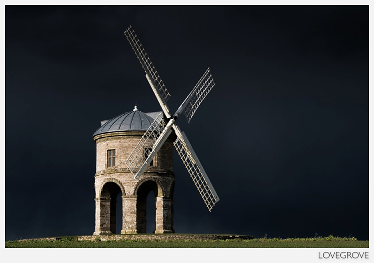 Chesterton Windmill in Warwickshire England UK in sunlight with a distant storm approaching.